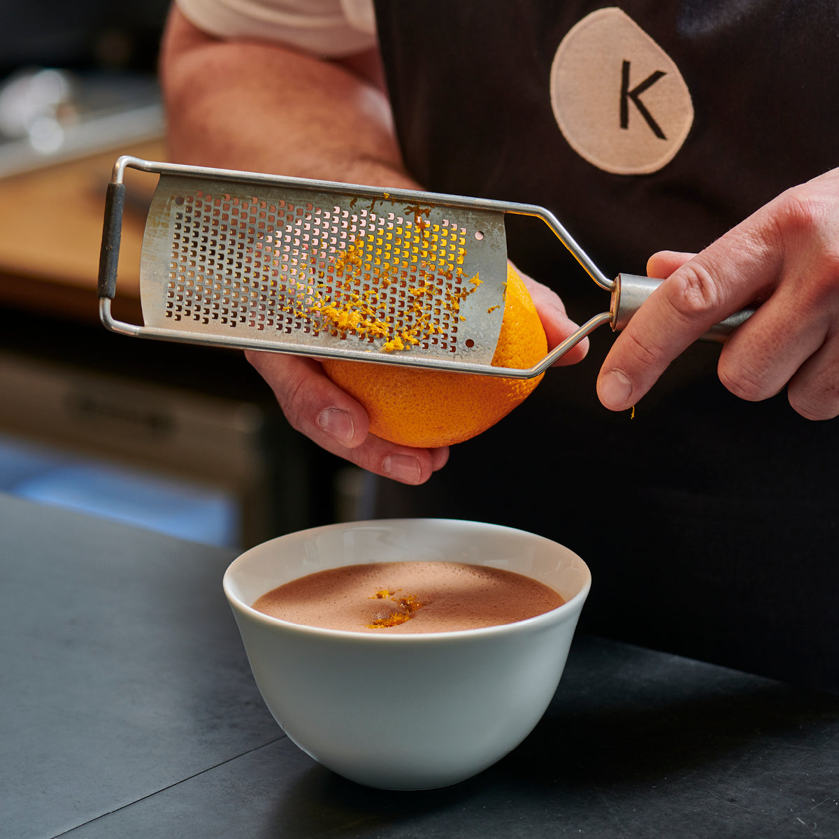 Orange grated into hot chocolate