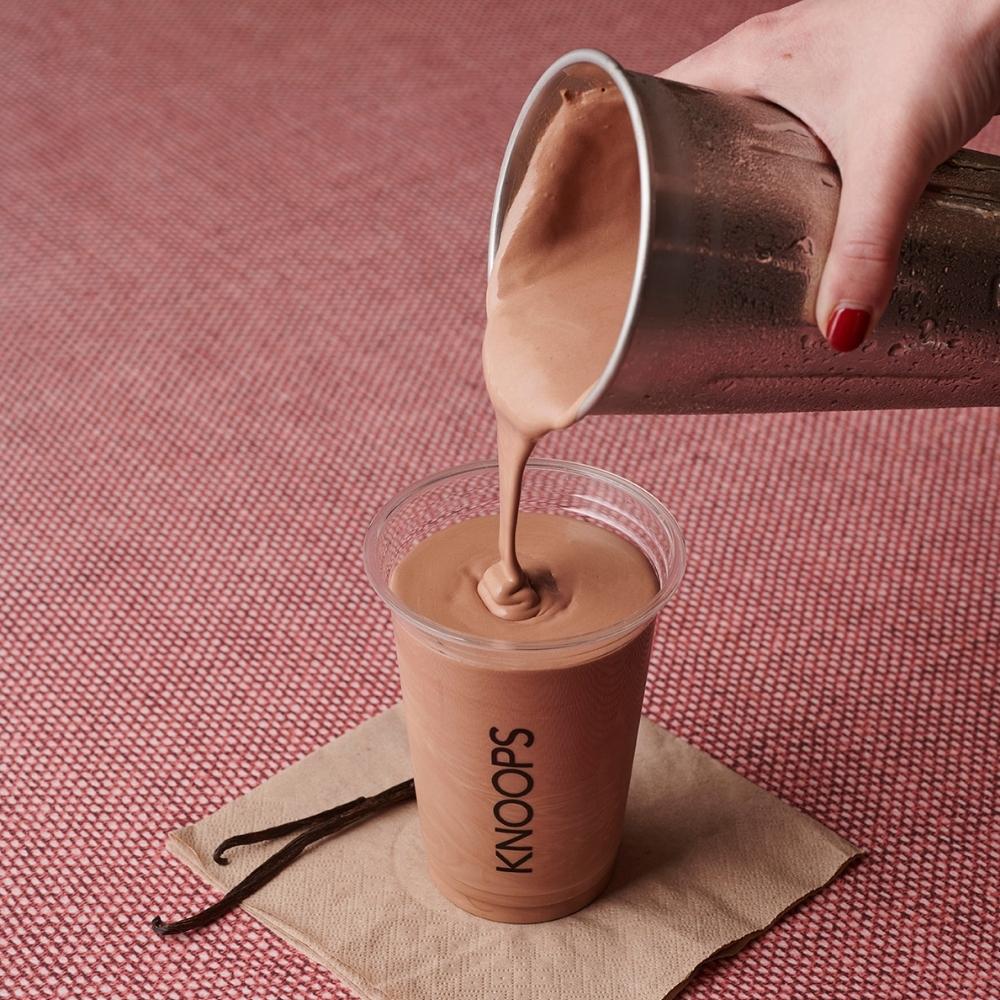Pouring chocolate milkshake
