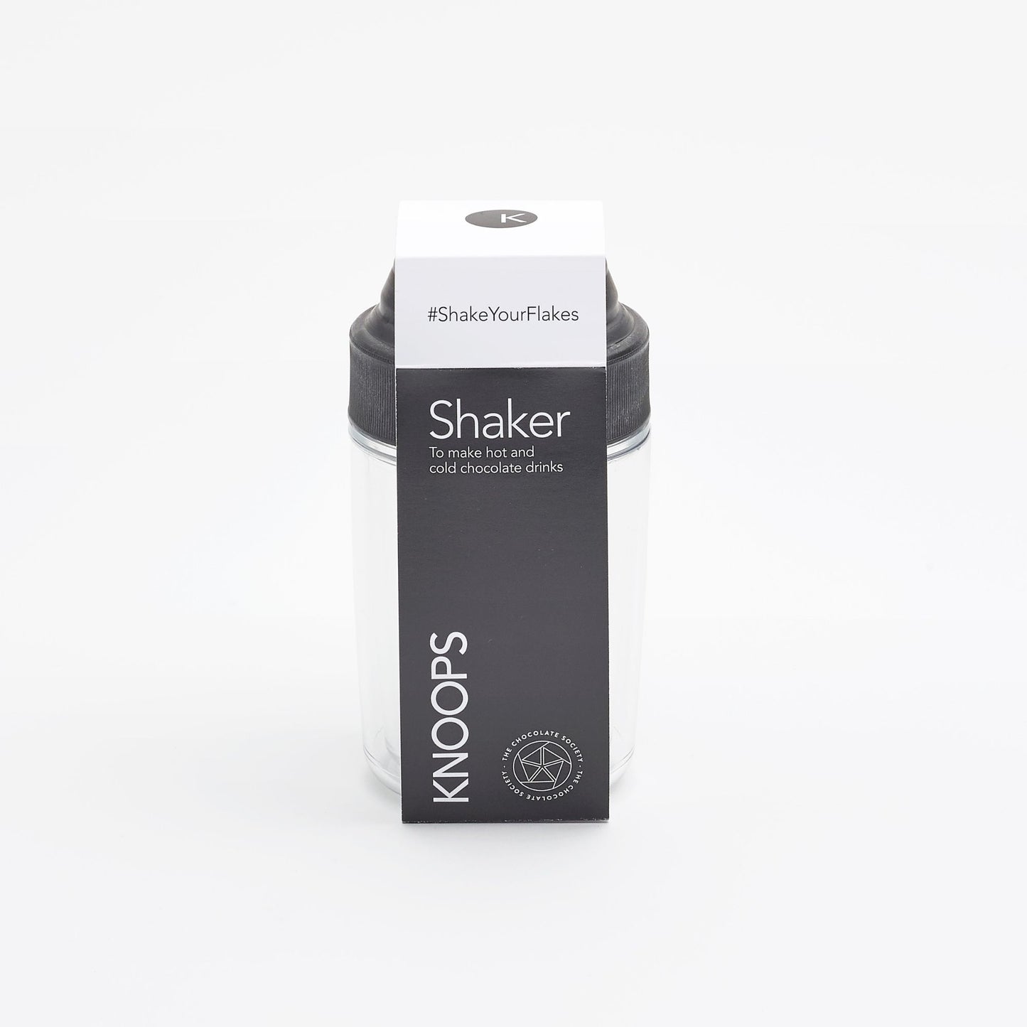 A packaged hot chocolate shaker by KNOOPS, with branding and product information visible on the box.